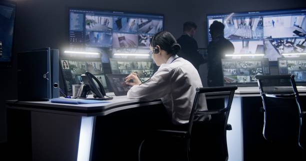 istock Female officer controls CCTV cameras using tablet 1491319820
