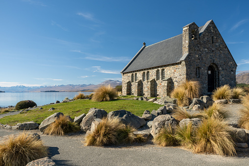 An iconic image of the stone chapel on the shore of Lake Tekapo New Zealand