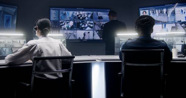 istock Security employees monitoring CCTV cameras 1491320176