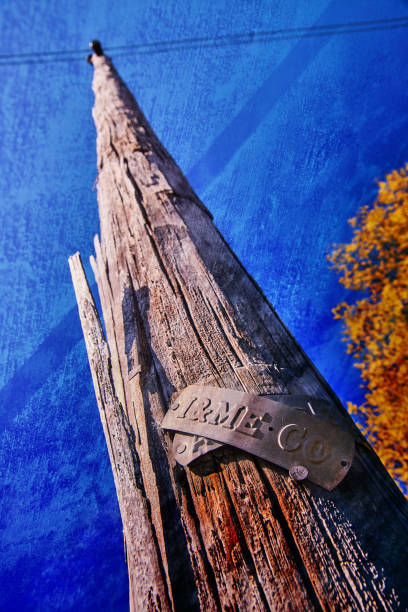 istock Telephone pole with texture overlay against blue sky 1491322277