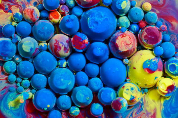 istock Texture of orbs of acrylic paint floating on surface in cluster 1491322326