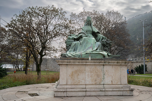 Budapest, Hungary - November 26th, 2022: A bronze statues of hungarian queen Elisabeth, or Sisi, in a Budapest park on a hazy day.