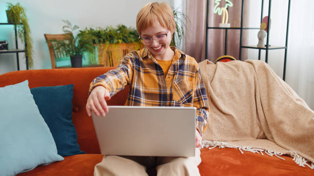 istock Pretty woman freelancer opens laptop, starts working education sends messages makes online purchases 1491322775