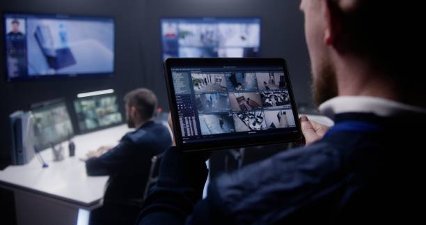 istock Security officer zoom CCTV cameras uses tablet 1491322807