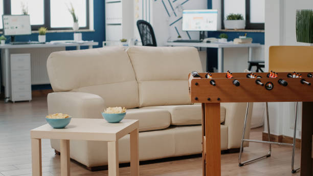 istock Nobody in business workplace with foosball table and couch 1491323184