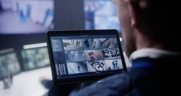 istock Security officer zoom CCTV cameras uses tablet 1491323198