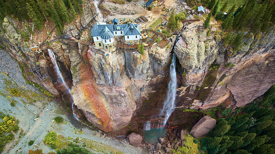 Image of View of power station at top of cliffs with waterfalls