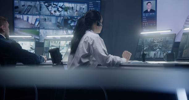 istock Female operator work in police surveillance room 1491324240