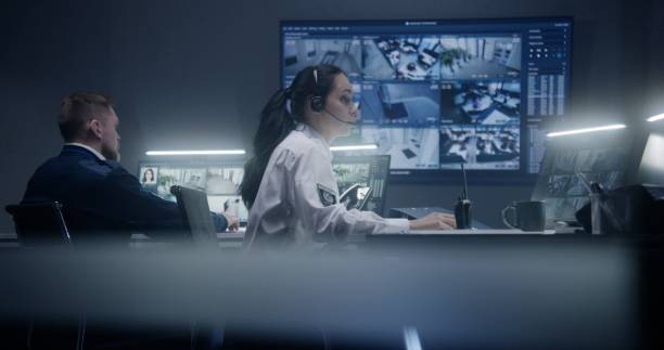 istock Female operator work in police surveillance room 1491324371
