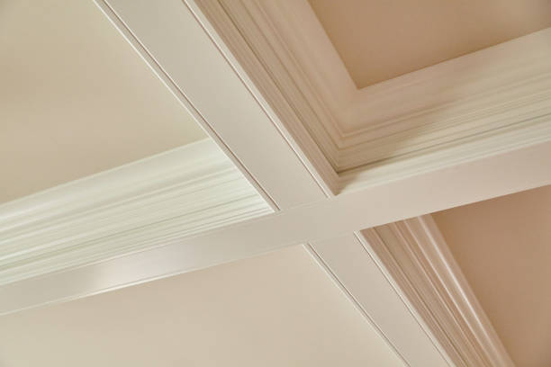 istock White crown molding on the ceiling forms a cross on an off white ceiling 1491324826