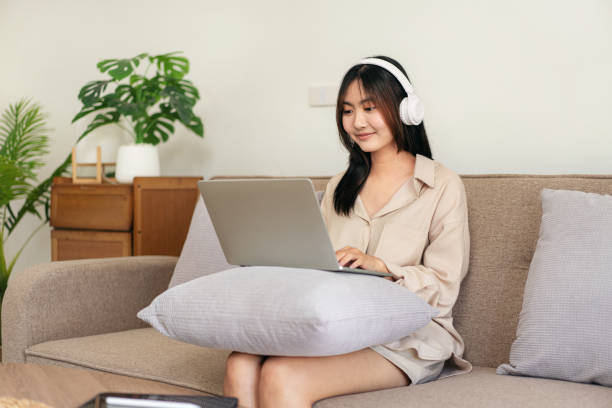 istock Female entrepreneur is sitting on big comfortable sofa and putti 1491325779