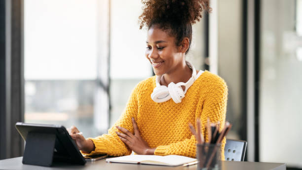 istock African american student woman in sweater watching e-learning an 1491326148