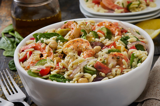 Mediterranean Orzo and Shrimp Salad with Baby Spinach, Feta, Cherry Tomatoes, Cucumber, Olives, Red Onion, Red Peppers and Chick Peas