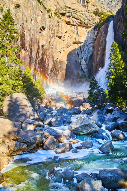 istock Yosemite Falls with frosty waters over rocks and rainbow 1491326462