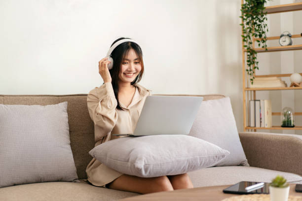 istock Female entrepreneur is sitting on big comfortable sofa and putti 1491326704