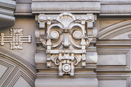 Old relief bar, a keystone in a building arch, of an old bearded man face in the historical downtown of Dresden, Germany, details, with copy space