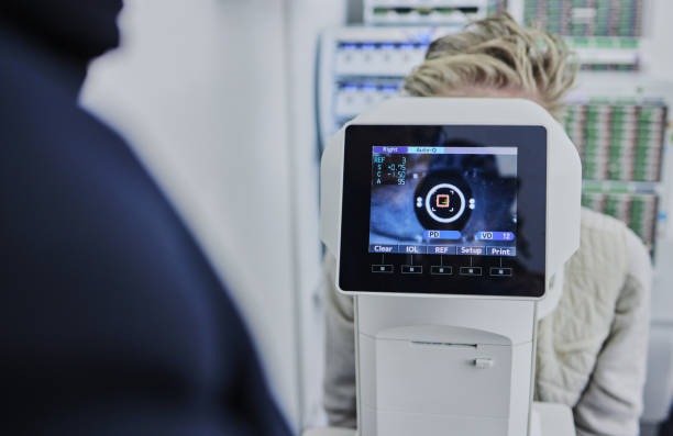 istock Optometry, digital screen for eye exam and woman with machine for vision test, eyesight and optical assessment. Healthcare, ophthalmology and optometrist with patient in medical camera for eyes scan 1491328308