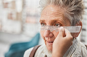 Optometry, ruler and doctor measuring eyes of a woman for glasses, frame fitting and eye distance. Healthcare, medical and mature patient with an optometrist to measure vision, lens and eyesight