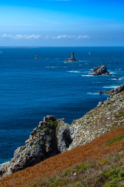 Spectacular Cliffs And Lighthouse At Peninsula Pointe Du Raz At The Finistere Atlantic Coast In Brittany, France
