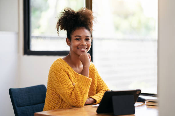 istock African american student woman in sweater using digital tablet t 1491329204
