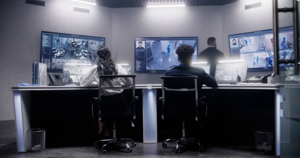 istock Security officers team work in surveillance room 1491330006
