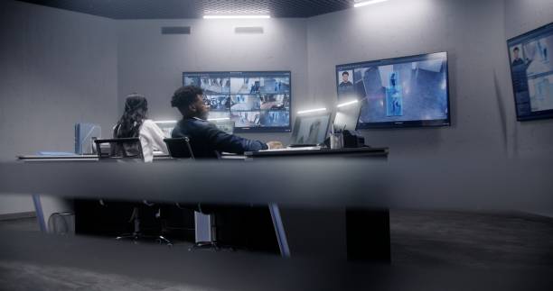 istock Security officers team work in surveillance room 1491330597