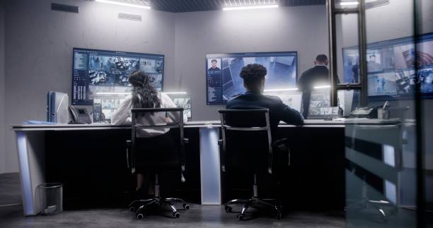 istock Security officers team work in surveillance room 1491330724