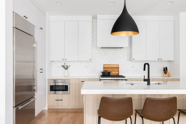 A kitchen detail with white and white oak cabinets.