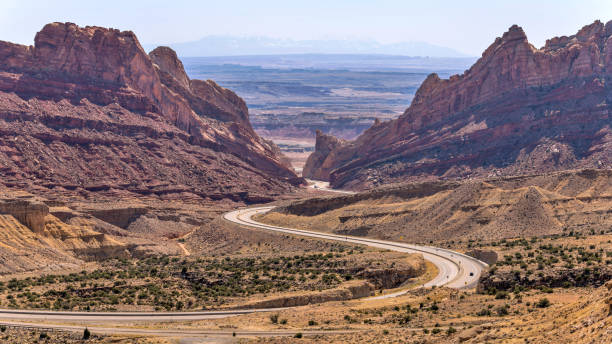 istock San Rafael Swell - A panoramic Spring morning view of Interstate Highway I-70 winding through San Rafael Swell. Utah, USA. 1491331603