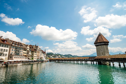 Historic city center of Lucerne with famous Chapel Bridge with blue sky and clouds, Canton of Lucerne, Switzerland