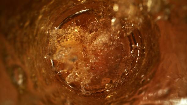 istock Fresh Beer Pouring into Glass as Macro Close Up Top Shot 1491334140