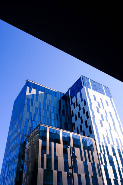 istock Low angle view of modern buildings against clear sky 1491335297