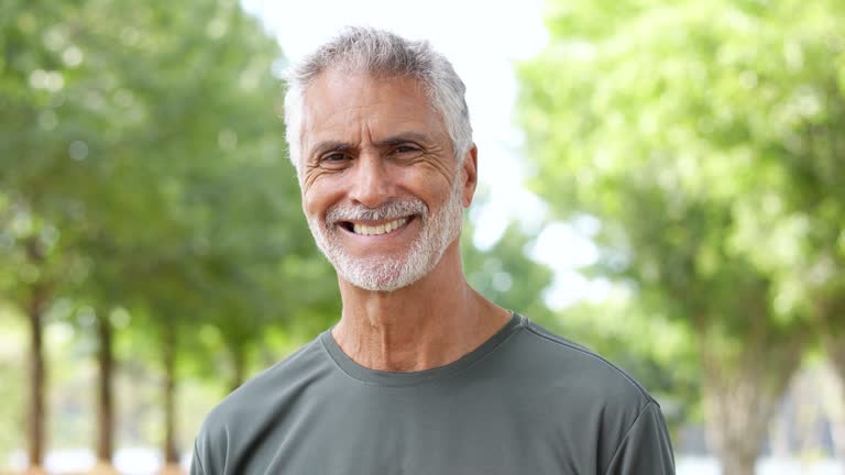 Portrait of a senior man on a workout in the public park