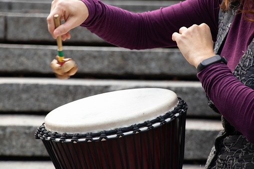 playing the drum with hands close-up, musical instrument