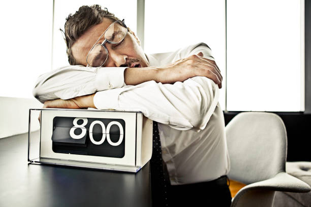 Businessman sleeping at the office Businessman sleeping at the office man sleeping chair stock pictures, royalty-free photos & images