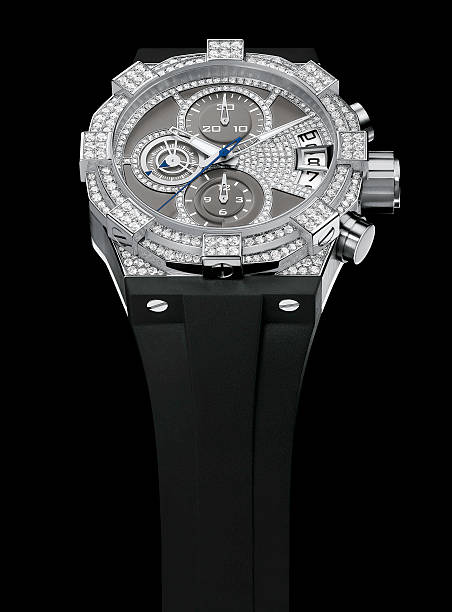 A silver luxury wrist watch with a black band