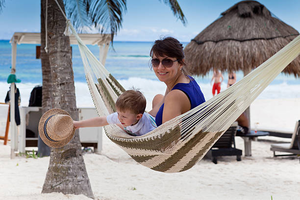 istock Happy mother with her son on a caribbean beach 149134246