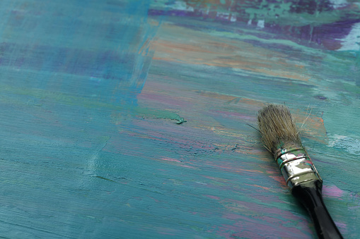 Paintbrush on multi color background