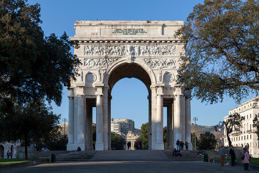 Genoa, Italy - March 29 2019: The Arco della Vittoria (Victory Arch), also known as Monumento ai Caduti or Arco dei Caduti (Arch of the Fallen), is a memorial arch located in Piazza della Vittoria.