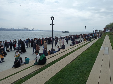 Istanbul, Türkiye – April 21, 2023: The people who came to visit the amphibious assault ship TCG Anadolu (L-400) anchored in Sarayburnu Port formed long queues.