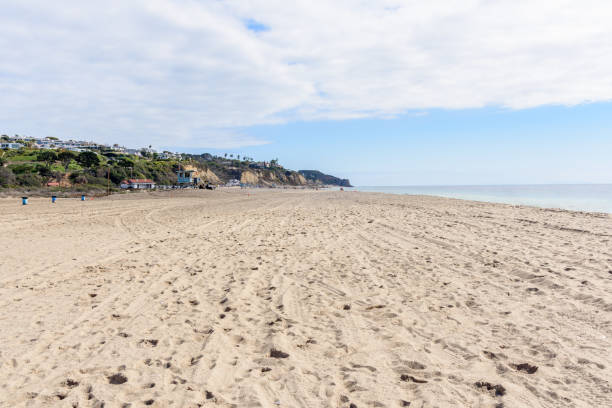 istock Large sandy beach on a partly cloudy autumn day 1491350544