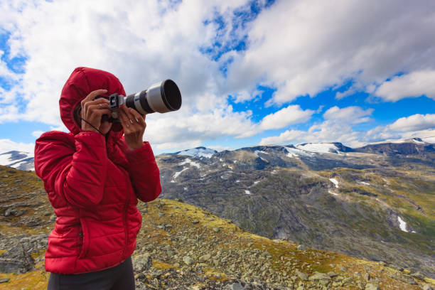 istock Tourist taking photo fin norwegian mountains 1491350589