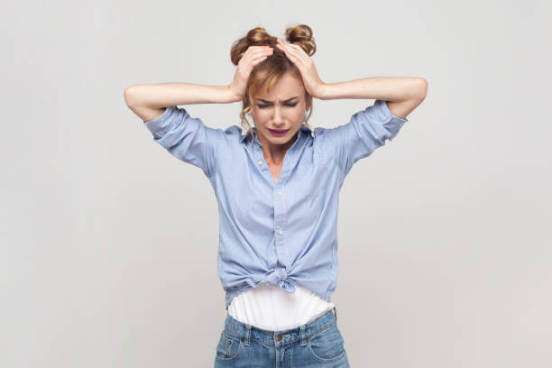 istock Woman suffering from migraine, touching head, needs painkillers, cannot hold pain, feels discomfort. 1491350830