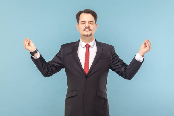 istock Relaxed man with mustache standing feels peaceful, practicing yoga, relaxing. 1491350925