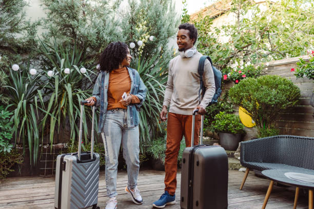 istock African-American tourists with suitcases 1491355793