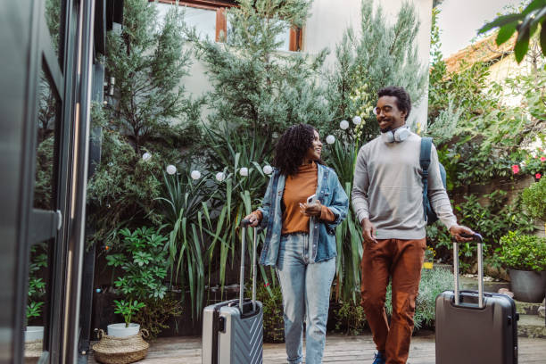 istock African-American tourists with suitcases 1491356792