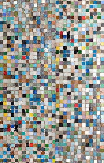 Colorful abstract mosaic with vibrant tiles, creating a captivating visual pattern. Diverse hues and shades blend harmoniously, forming a dynamic composition of geometric shapes. A visually striking artwork with a mesmerizing interplay of colors and textures.