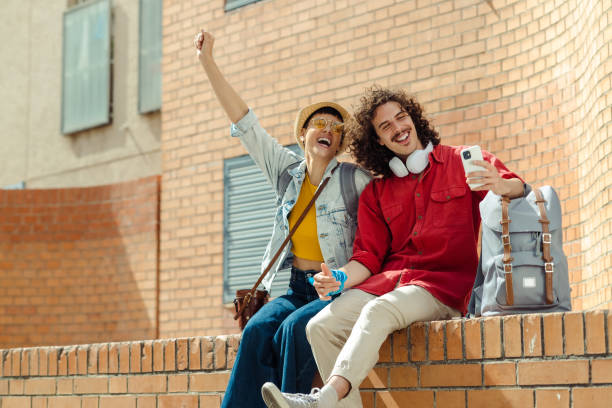 istock Tourists with backpacks taking selfie in the city 1491363258