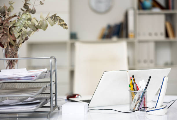 istock Workplace in office with white interior and accessories 1491364906