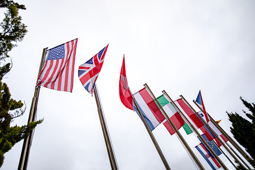 Langkawi, Malaysia - Mar 29, 2019. Flags of different countries in the park of Langkawi Airport (LGK).